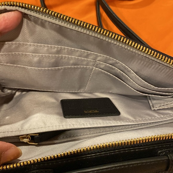 Tumi crossbody bag.
Length is 8.5 inches 
Height is 5.5 inches - Picture 6 of 15